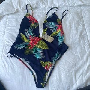 One piece bathing suit never worn tags are still attach